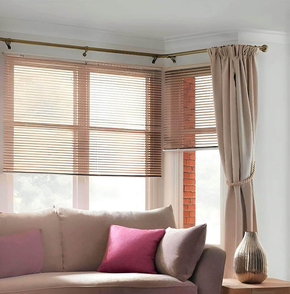 5-sided bay window dressed in curtains hanging form Bay Window Curtain Pole