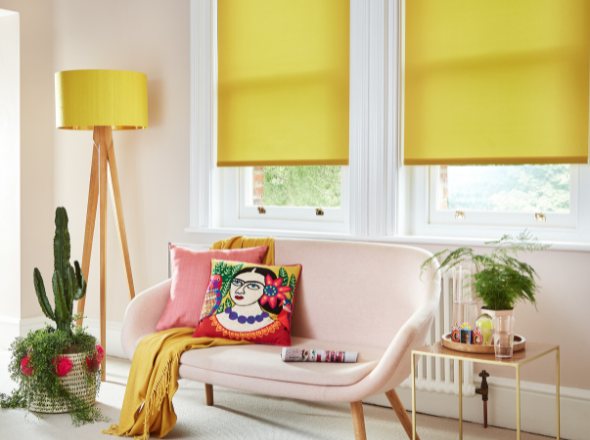 Bright yellow roller blinds  in a modern living room decorated with yellow accents and plants