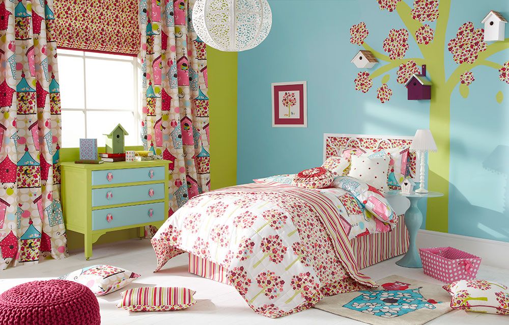Brightly coloured lime green and turquoise childrens bedroom with matching wall art.