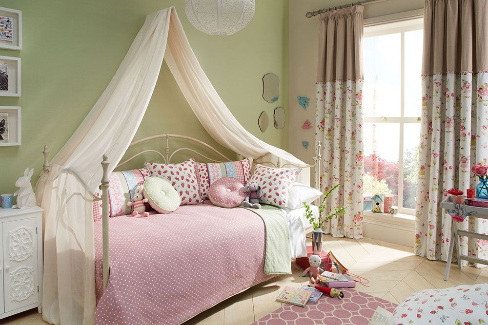 Girls bedroom with a voile bed drape over the length of the bed.
