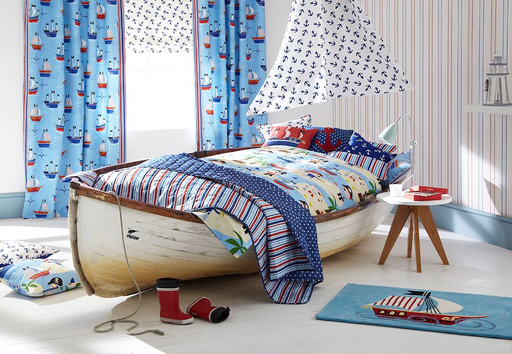 Boat themed childs bedroom with the bed made from an old clinker built dingy.