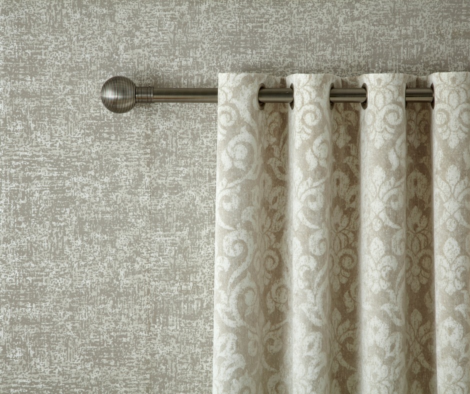 Beige curtains on a metal curtain pole
