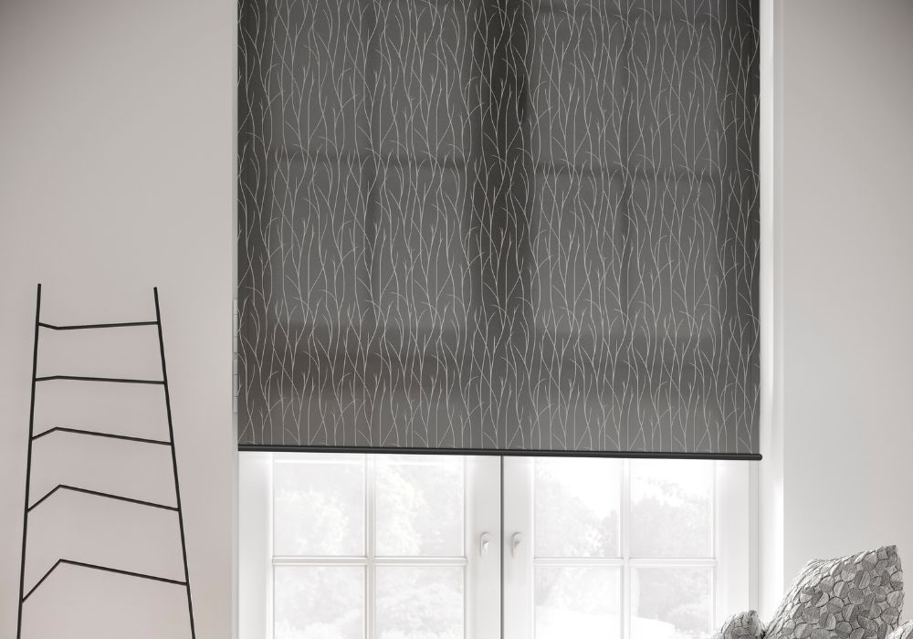 A grey roller blind fitted in a door leading into the garden
