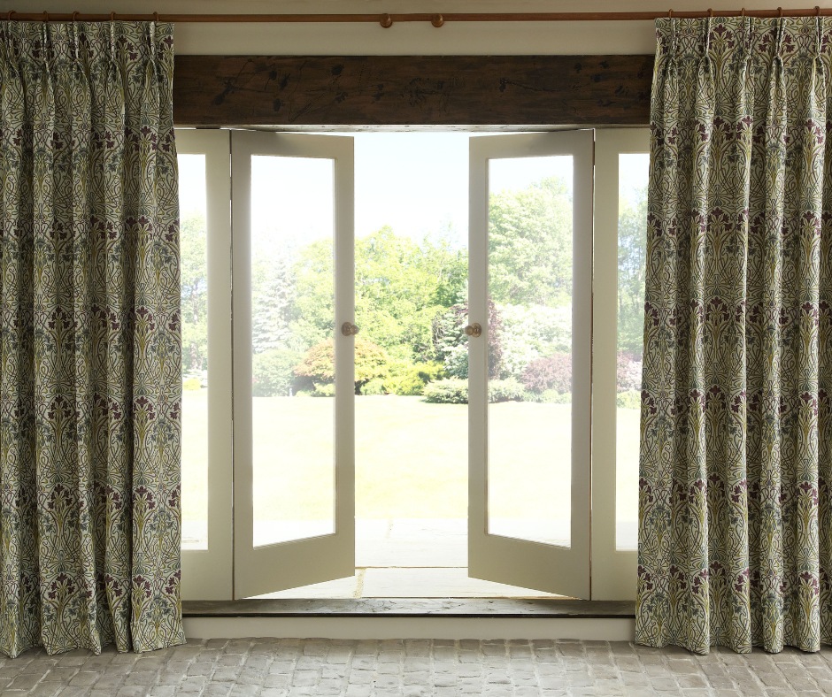 A spring morning with open glass doors looking onto a green garden